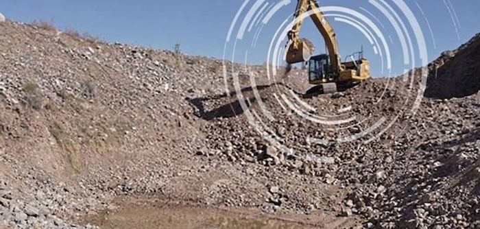 Caterpillar excavator working a remote gravel pit site