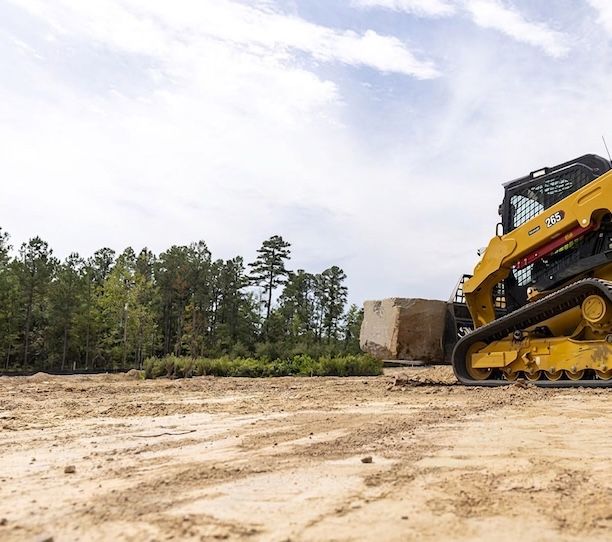 Caterpillar skid steer working a remote job site