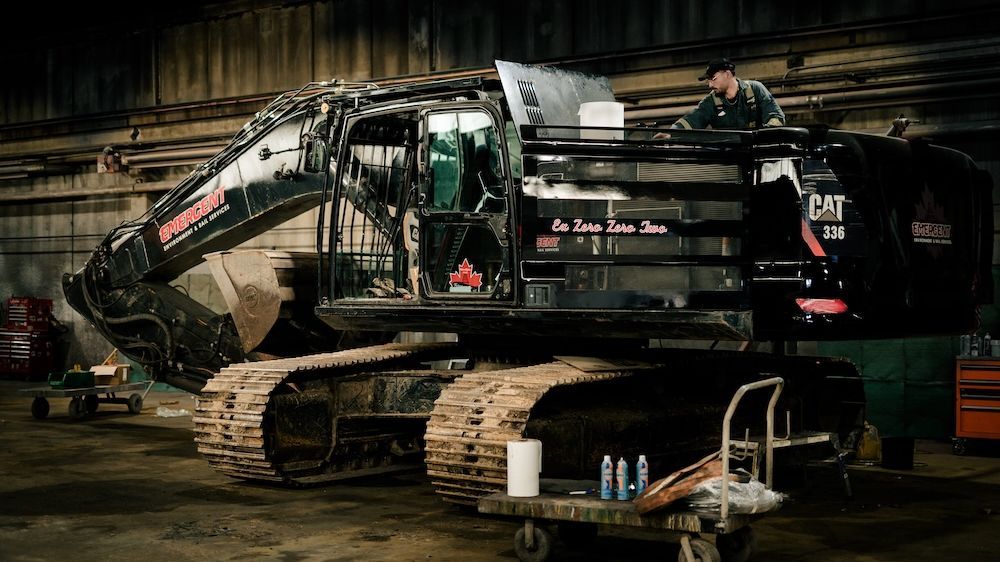 Tracked excavator in for service inside the Mach 6 Edmonton facility