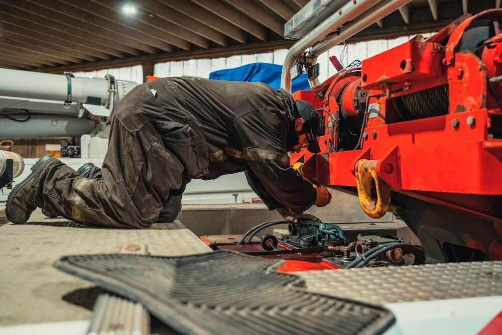 Mach 6 technician working a detail repair on heavy equipment